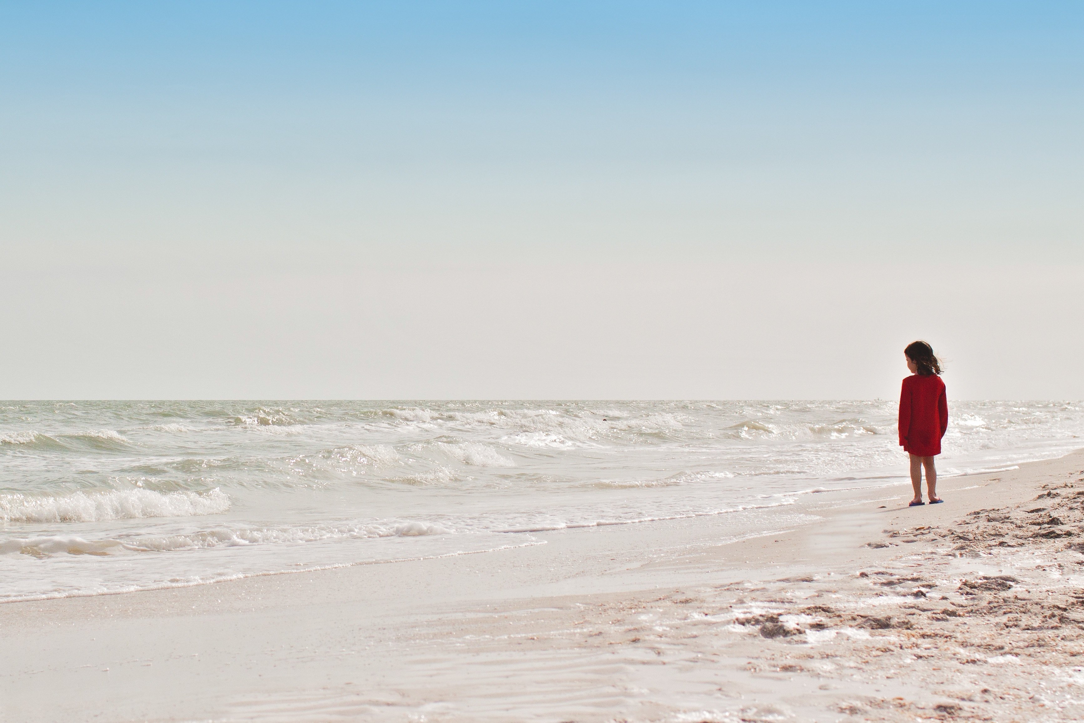 girl-walking-on-beach